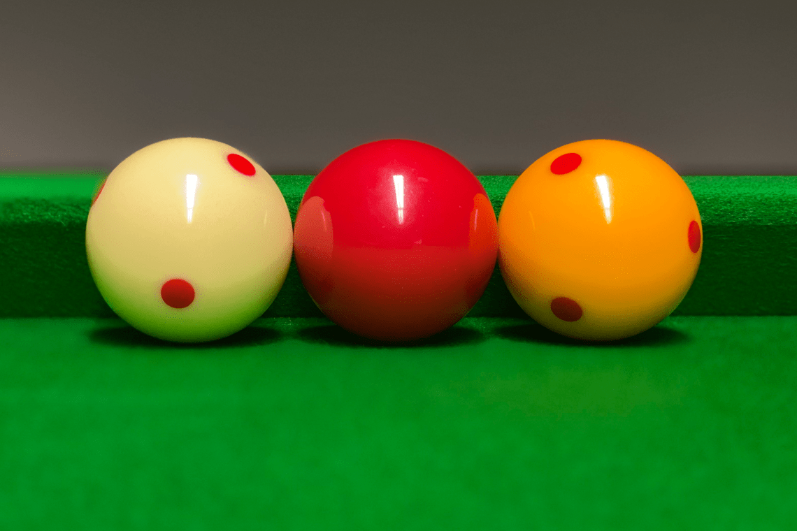 Billiard balls along the top cushion