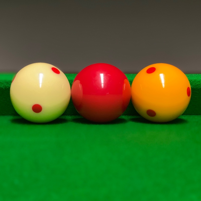 Billiard Balls Lined Up Along The Cushion