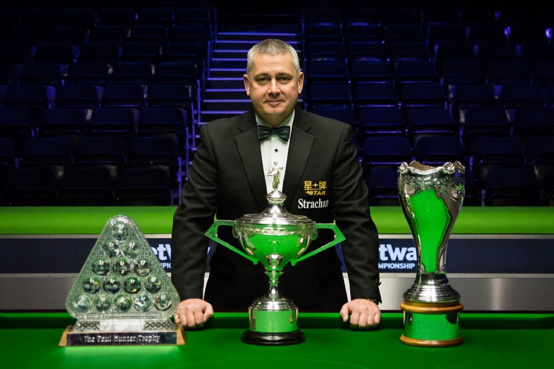 Paul Collier pictured with Snooker's 'Triple Crown' trophies