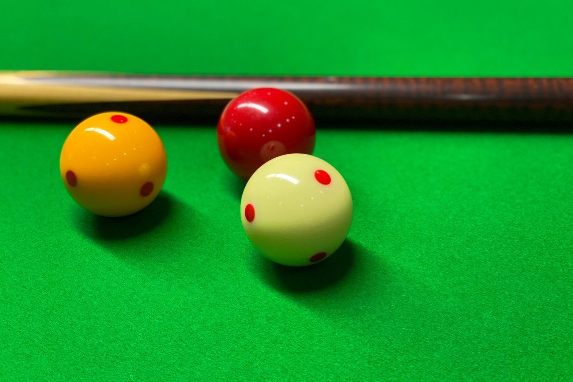 Billiard balls and cue