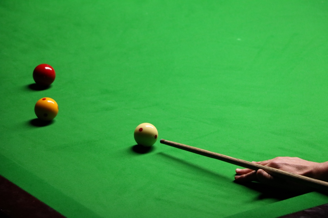 Billiard player playing a stroke